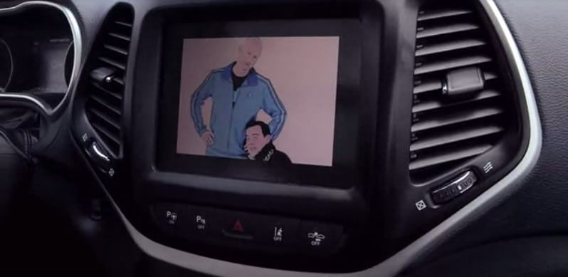 Miller and Valasek used a wireless hack to take control of a Jeep Cherokee, installing an image of themselves on the dashboard monitor. 