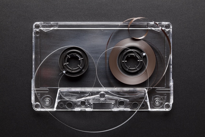 Old cassette tape on black background